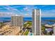 Aerial view showcases a tall high-rise building with marina and ocean views at 175 1St S St # 3008, St Petersburg, FL 33701