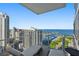 Balcony with lounge chairs overlooking city and harbor views at 175 1St S St # 3008, St Petersburg, FL 33701