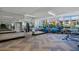 Bright gym with exercise equipment, mirrors, rubber flooring, and large windows at 175 1St S St # 3008, St Petersburg, FL 33701