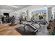 Bright gym with workout machines, weights, rubber flooring, and large windows at 175 1St S St # 3008, St Petersburg, FL 33701