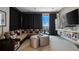 Living room featuring an entertainment system, bookshelf, and city views at 175 1St S St # 3008, St Petersburg, FL 33701
