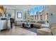 Bright living space with floor-to-ceiling windows and comfortable seating, offering stunning views of the city skyline at 175 1St S St # 3008, St Petersburg, FL 33701