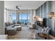 Cozy living room with comfortable seating, city view, and access to a balcony at 175 1St S St # 3008, St Petersburg, FL 33701
