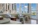 Sitting area with chairs, side tables, and ottomans with views to the city at 175 1St S St # 3008, St Petersburg, FL 33701