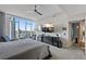 Bright main bedroom with stunning views, a ceiling fan, and a modern entertainment center at 175 1St S St # 3008, St Petersburg, FL 33701