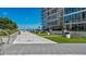 Rooftop lounge area featuring modern outdoor seating and manicured artificial turf with distant ocean views at 175 1St S St # 3008, St Petersburg, FL 33701
