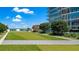 Beautiful rooftop green space with turf and distant ocean views providing relaxation and recreation at 175 1St S St # 3008, St Petersburg, FL 33701