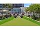 Lush rooftop green space featuring manicured turf, stylish decor and landscaping at 175 1St S St # 3008, St Petersburg, FL 33701