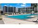 Rooftop pool with lounge chairs and clear blue water, set against a backdrop of high-rise buildings at 175 1St S St # 3008, St Petersburg, FL 33701