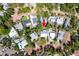 A beautiful home nestled amongst lush trees and greenery from an aerial view at 2019 Inner S Cir, St Petersburg, FL 33712