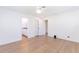 Bright bedroom features wood-look flooring, ceiling fan, and two closets at 2019 Inner S Cir, St Petersburg, FL 33712