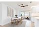 Airy dining room with white walls, light wood floors, and large windows offering natural light at 2019 Inner S Cir, St Petersburg, FL 33712