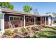 Charming front porch with rocking chairs and brick accents, perfect for enjoying the outdoors at 2019 Inner S Cir, St Petersburg, FL 33712