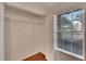 Walk-in closet with custom shelving and a window at 209 Lake Brook Cir # 104, Brandon, FL 33511