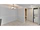 Bright dining area with tile flooring adjacent to the bathroom and laundry at 209 Lake Brook Cir # 104, Brandon, FL 33511