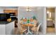 Dining room with seating for four, stylish furnishings and modern light fixture at 209 Lake Brook Cir # 104, Brandon, FL 33511