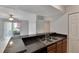 Kitchen counter features granite countertop and stainless steel sink at 209 Lake Brook Cir # 104, Brandon, FL 33511
