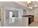 Well-lit living room with tile floors and a sliding glass door to balcony at 209 Lake Brook Cir # 104, Brandon, FL 33511