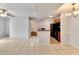 Bright, open-concept living space with tile flooring leading to kitchen area at 209 Lake Brook Cir # 104, Brandon, FL 33511
