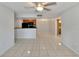 Spacious living area featuring tile floors and views of the kitchen and dining area at 209 Lake Brook Cir # 104, Brandon, FL 33511