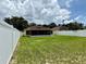 Fully fenced backyard featuring lush green lawn and a screened-in porch attached to the home at 224 Chardonnay Pl, Valrico, FL 33594
