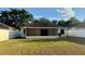 View of the rear exterior and enclosed patio of this single Gathering home with ample yard space at 224 Chardonnay Pl, Valrico, FL 33594