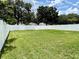 Spacious backyard with a well-maintained lawn and a white vinyl fence around the perimeter at 224 Chardonnay Pl, Valrico, FL 33594