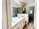 Well-lit bathroom features dual sinks, a spacious shower, and modern fixtures at 224 Chardonnay Pl, Valrico, FL 33594