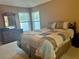 Serene bedroom boasts natural light, neutral tones, and ample space at 224 Chardonnay Pl, Valrico, FL 33594