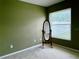 Neutral bedroom with a large window and a decorative standing mirror at 224 Chardonnay Pl, Valrico, FL 33594