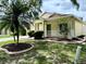 Charming single-story home with a well-manicured lawn and landscaping, featuring a covered entry at 224 Chardonnay Pl, Valrico, FL 33594
