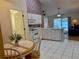 Bright kitchen features white cabinets, tile flooring, and a breakfast nook perfect for casual dining at 224 Chardonnay Pl, Valrico, FL 33594