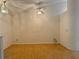 Spacious living room boasts wood floors, vaulted ceilings, and a ceiling fan at 224 Chardonnay Pl, Valrico, FL 33594