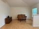 Cozy living room with hardwood floors, comfortable leather sofa, and natural light at 224 Chardonnay Pl, Valrico, FL 33594
