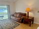 Cozy living room with sliding glass doors, comfortable seating, and stylish decor at 224 Chardonnay Pl, Valrico, FL 33594