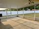 Spacious screened-in patio with concrete flooring and ceiling fan, perfect for outdoor relaxation at 224 Chardonnay Pl, Valrico, FL 33594