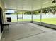 Screened-in patio featuring a ceiling fan and concrete flooring overlooking backyard with a fence at 224 Chardonnay Pl, Valrico, FL 33594
