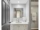 Bright bathroom featuring a vanity with a white countertop, gray walls, and modern fixtures at 2644 2Nd Ct, Palm Harbor, FL 34684
