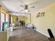 Bedroom with wood-look floors, light yellow walls, and mirrored closet doors at 2644 2Nd Ct, Palm Harbor, FL 34684