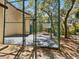 Exterior shot of the community handball court and surrounding landscape at 2644 2Nd Ct, Palm Harbor, FL 34684