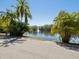A picturesque view of the lake with a fountain at 2644 2Nd Ct, Palm Harbor, FL 34684