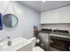 Convenient laundry room and half bath, equipped with modern washer and dryer, and ample storage at 2644 2Nd Ct, Palm Harbor, FL 34684