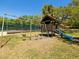 Image of the outdoor playground featuring swings and a slide for Gathering fun at 2644 2Nd Ct, Palm Harbor, FL 34684