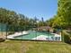 View of the community pool and spa area with plenty of room for lounging at 2644 2Nd Ct, Palm Harbor, FL 34684