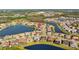 Panoramic aerial view highlighting the neighborhood's pond, lush landscaping, and serene setting at 28355 Picana, Wesley Chapel, FL 33543