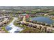 Panoramic aerial view highlighting the neighborhood's pond, lush landscaping, and serene setting at 28355 Picana, Wesley Chapel, FL 33543