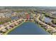Panoramic aerial view highlighting the neighborhood's pond, lush landscaping, and serene setting at 28355 Picana, Wesley Chapel, FL 33543