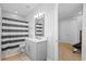 Bathroom features stylish design, tub with shower, and wood-look floors at 28355 Picana, Wesley Chapel, FL 33543