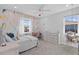 Bright bedroom with a colorful accent wall, desk, and hanging chair at 28355 Picana, Wesley Chapel, FL 33543