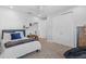 Cozy bedroom features a comfortable bed and large closet with shelving at 28355 Picana, Wesley Chapel, FL 33543